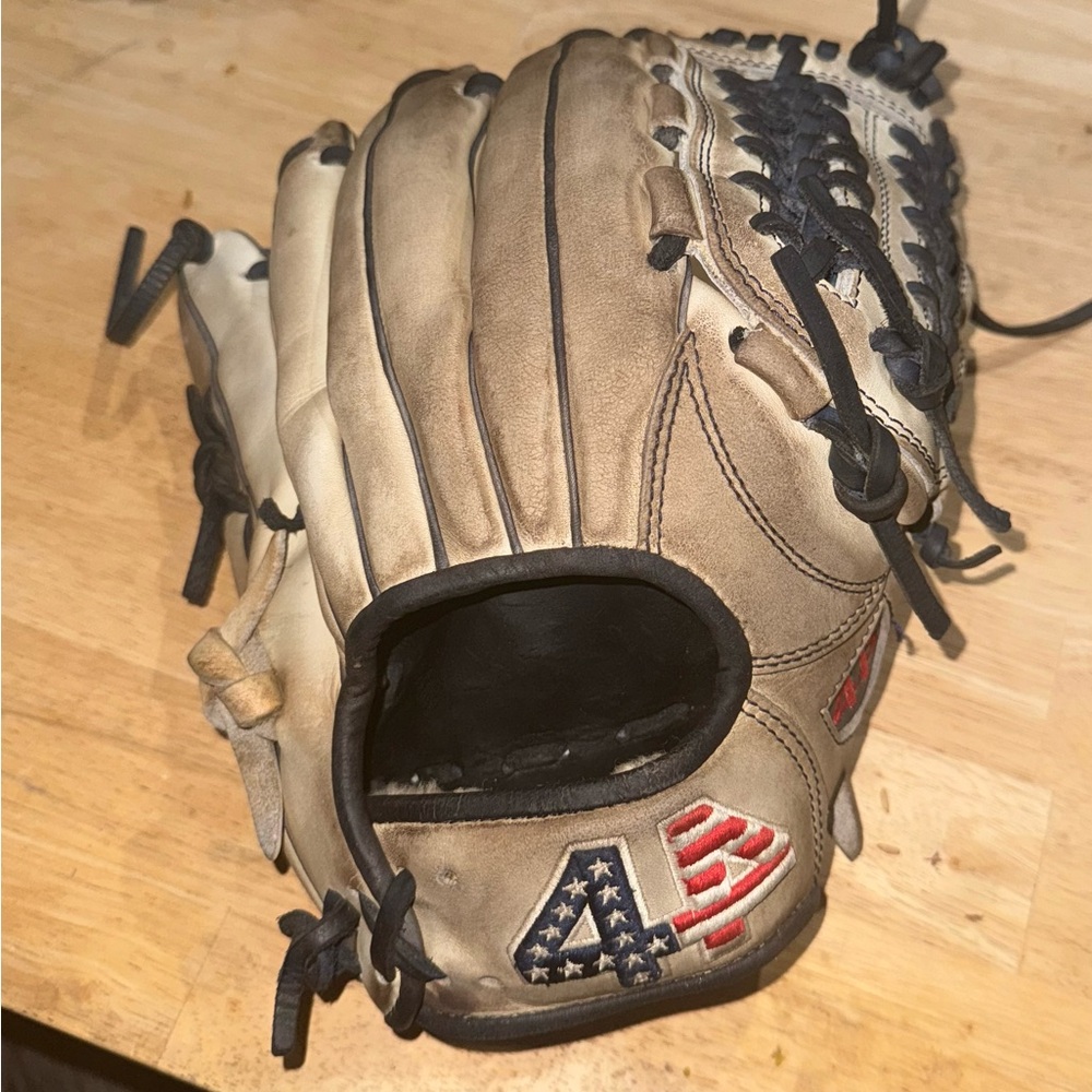 44 Pro Glove size 12in Great condition and formed really well by a d1 player.